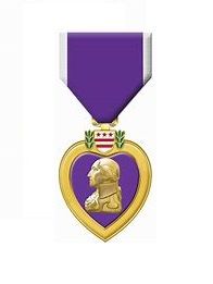 The ultimate decoration for a combat soldier is the Purple Heart which designates wounded in battle.